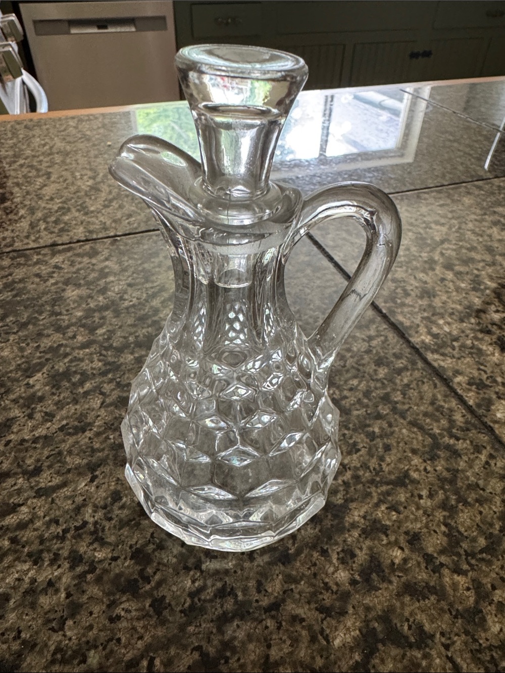 Vintage glass cruet with glass stopper
